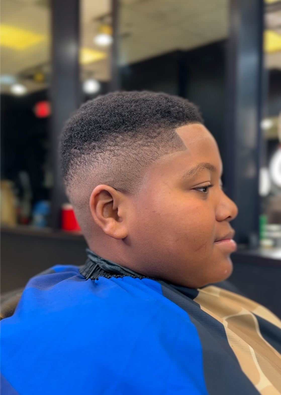 Short crop with a tight taper and moustache